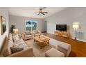 Spacious living room with hardwood floors and comfy seating at 7856 Habersham Dr, Lakeland, FL 33810