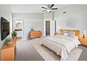 Relaxing main bedroom boasts soft carpet, and ensuite bathroom access at 7856 Habersham Dr, Lakeland, FL 33810