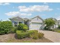 Charming one-story home featuring well-maintained landscaping and a brick-paved driveway at 2132 Antilles Club Dr, Kissimmee, FL 34747