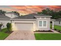One story home with attached garage and landscaped front yard at 3225 Stratton Cir, Kissimmee, FL 34744