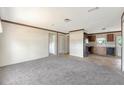 Bright and airy living room with fresh paint and new neutral carpeting at 9100 Sw 32Nd Ct, Ocala, FL 34476