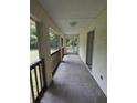 Enclosed back porch featuring a neutral color scheme and outdoor access at 497 Beresford, Deland, FL 32720