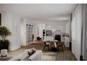 Open-concept living and dining area featuring modern design, clean lines, and ample natural light at 1102 East Pkwy, Deland, FL 32724