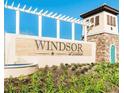 Windsor at Westside community sign featuring stone accents and manicured landscaping at 8924 Adriatico Ln, Kissimmee, FL 34747