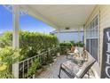 Peaceful front porch decorated with potted plants and comfortable seating at 1452 Brookebridge Dr, Orlando, FL 32825