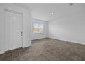 Bright living room features tile floors, a front door and a large window with natural light at 1197 Happy Forest Loop, Deland, FL 32720