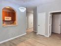 Living room showcasing wood floors, gray paint, and a modern chandelier at 3224 Dante Dr # 108, Orlando, FL 32835