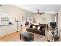 Comfortable living room with a ceiling fan and lots of natural light at 2495 Sedgefield Ave, Deltona, FL 32725