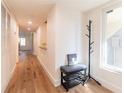 Bright hallway with wood floors, closet, coat rack, and a window at 1994 Kenaston Rd # 1994, Maitland, FL 32751