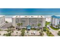 Oceanfront building with parking and tropical landscaping at 4631 S Atlantic Ave # 8301, Ponce Inlet, FL 32127
