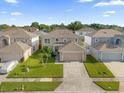 Well-maintained two-story home with landscaped front yard in a peaceful neighborhood at 132 Spanish Bay Dr, Sanford, FL 32771