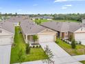 Well-maintained homes with manicured lawns in a Gathering-friendly community, and a view of the neighborhood at 957 King Parc Rd, Orange City, FL 32763