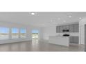 Bright open-concept kitchen and living space with ample natural light and backyard view at 4939 Worchester Dr, Kissimmee, FL 34746