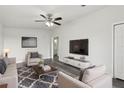 Bright living room featuring modern furniture and neutral colors at 610 Walker St, Holly Hill, FL 32117