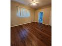 Bright bedroom boasts hardwood floors and access to the ensuite bathroom at 1611 Sand Key Cir, Oviedo, FL 32765