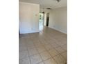 Bright and airy living room features neutral paint, and tile flooring throughout, creating a comfortable space at 605 Plum Ln, Altamonte Springs, FL 32701