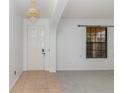 Bright entryway with tiled floors, chandelier, and access to other rooms at 10064 Silver Laurel Way, Orlando, FL 32832