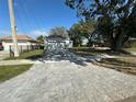 Well-maintained home featuring a concrete driveway and a tidy front yard at 4445 America St, Orlando, FL 32811