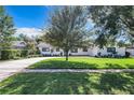 House exterior showcasing manicured lawn and driveway at 648 Brechin Dr, Winter Park, FL 32792