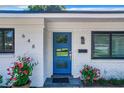 Stylish blue front door and white brick facade at 648 Brechin Dr, Winter Park, FL 32792