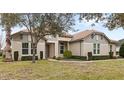 One story house with light beige walls and gray shake siding at 31722 Red Tail Blvd, Sorrento, FL 32776