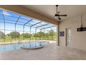 Spacious screened-in pool and spa with golf course views at 31722 Red Tail Blvd, Sorrento, FL 32776