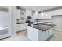 Modern kitchen featuring white cabinets, stainless steel appliances, and a dark countertops at 1211 Teal Creek Dr, St Cloud, FL 34771