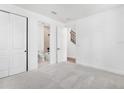 Bright bedroom with neutral carpet, closet, and adjoining bathroom at 2138 Whitney Marsh Aly, Orlando, FL 32804
