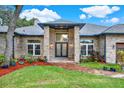 Elegant front entrance with brick walkway and double doors at 250 Shady Oaks Cir, Lake Mary, FL 32746