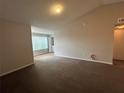 A view of the living room showcasing neutral paint and floors, and lots of natural light at 4642 Commander Dr # 933, Orlando, FL 32822