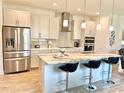 Modern kitchen with stainless steel appliances and an island at 3201 Songbird Cir, Harmony, FL 34773