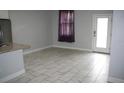 Bright dining area with tile flooring and access to backyard at 1148 Bancroft St, Deltona, FL 32725