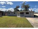 Charming single-story home with a well-manicured front lawn and inviting entrance at 2812 Dawley Ave, Orlando, FL 32806