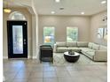 Spacious living room with sectional sofa and large windows at 2475 Hastings Blvd, Clermont, FL 34711