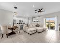 Open living room and kitchen with modern appliances and spacious island at 325 Daffodil Ln, Kissimmee, FL 34759