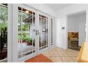 Bright entryway featuring double glass doors that offer natural light and views of the outdoors at 1521 Oxford Rd, Maitland, FL 32751