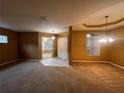 Open-concept living room with plush carpeting and a view into adjacent rooms at 284 Pinestraw Cir, Altamonte Springs, FL 32714