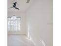 Bright bedroom with white walls, ceiling fan, and plantation shutters at 8162 Via Bella Notte, Orlando, FL 32836