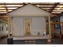 Under-construction home with visible support beams, illustrating the building process and design at 575 2Nd St, Oviedo, FL 32765