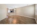 Spacious dining room with hardwood floors and kitchen views at 11757 Fitzgerald Butler Rd, Orlando, FL 32836