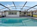 Inviting screened-in pool with covered patio and ample space for outdoor seating and relaxation at 260 S Fairbairn Dr, Deltona, FL 32725