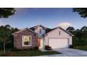 Charming single-Gathering home with stone accents, a two-car garage, and a well-manicured lawn at 1685 Andover Ridge Dr, Deland, FL 32720
