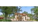 Stately home displays a red tile roof, porte cochere, and a welcoming front entrance at 732 Edgewater Dr, Orlando, FL 32804