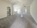 Spacious living room with an open layout, neutral colors, and recessed lighting at 4284 Sagefield Dr, Harmony, FL 34773