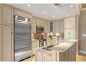 Bright kitchen with granite countertops, stainless steel appliances, and custom cabinetry for ample storage at 155 S Court Ave # 2710, Orlando, FL 32801