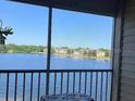 Relax on the balcony with scenic views of the serene lake at 1909 Summer Club Dr # 307, Oviedo, FL 32765