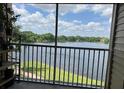 Relax on the balcony with scenic views of the serene lake at 1909 Summer Club Dr # 307, Oviedo, FL 32765