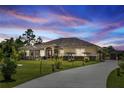 Single-story home with driveway, landscaping, and screened enclosure at 18920 Overton St, Orlando, FL 32833