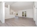 Bright and airy living room features neutral paint, new flooring, and natural light at 3186 Mapleshade St, Deltona, FL 32738