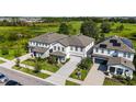 Three-house aerial view showing a community of new construction homes at 720 Split Hoof Dr, Saint Cloud, FL 34771